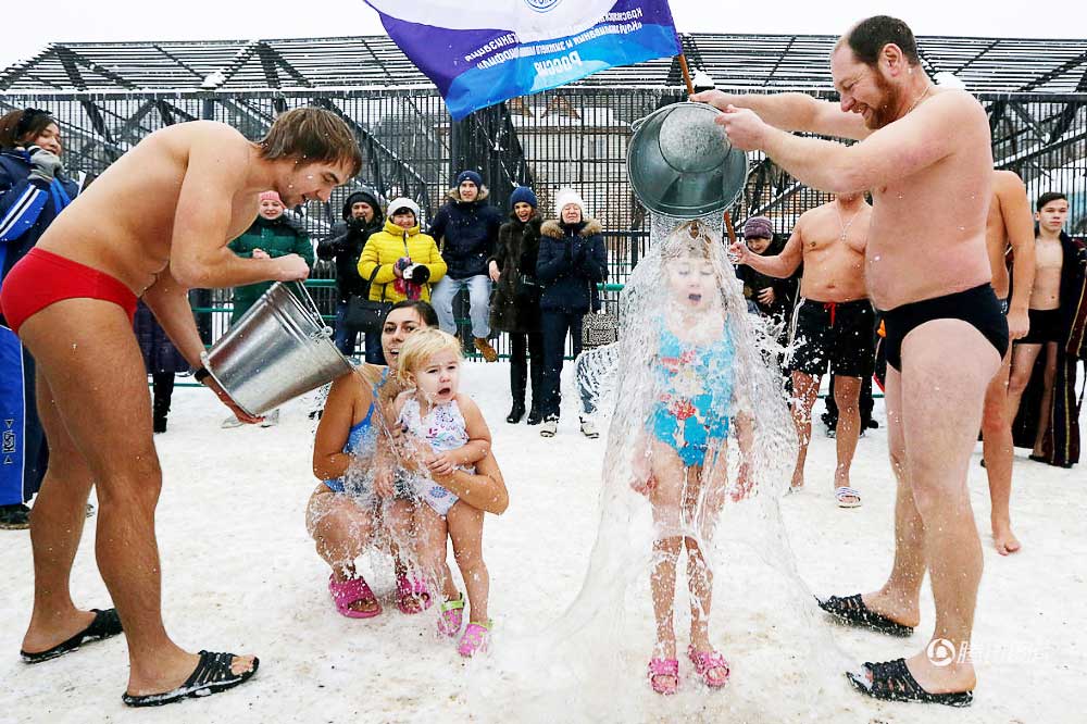 The Russian nursery children standing in the snow, challenge the ice bucket.